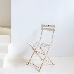 Silla de jardín en hierro patinado blanco