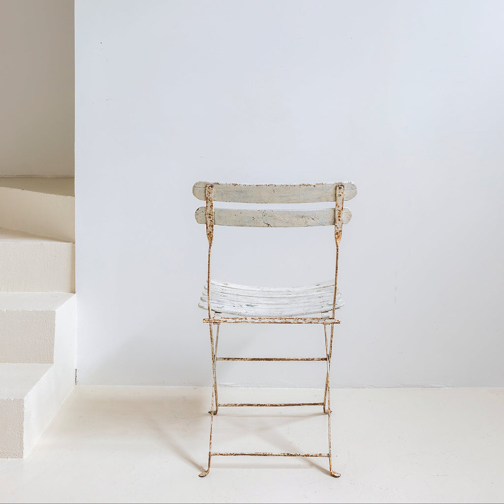 Silla de jardín en hierro patinado blanco