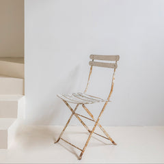 Silla plegable francesa de jardín en hierro patinado blanco