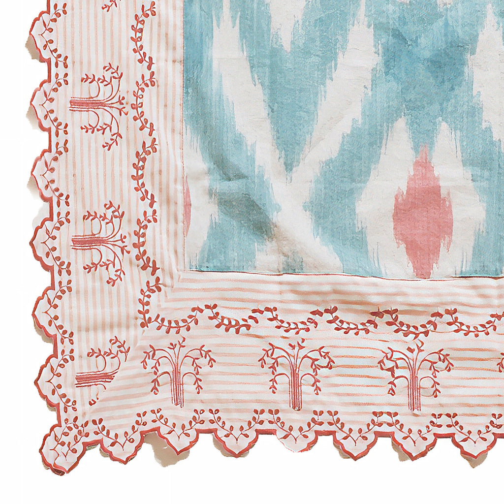 Mantel Ikat turquesa y rosa con cenefa bordada